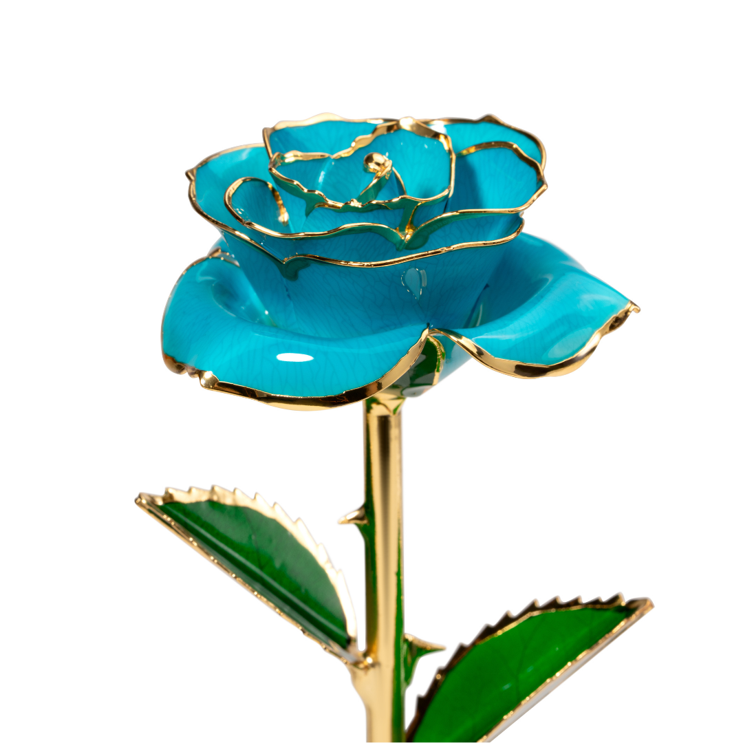 Close up of 24K gold dipped blue rose with blue enamel petals and gold trim