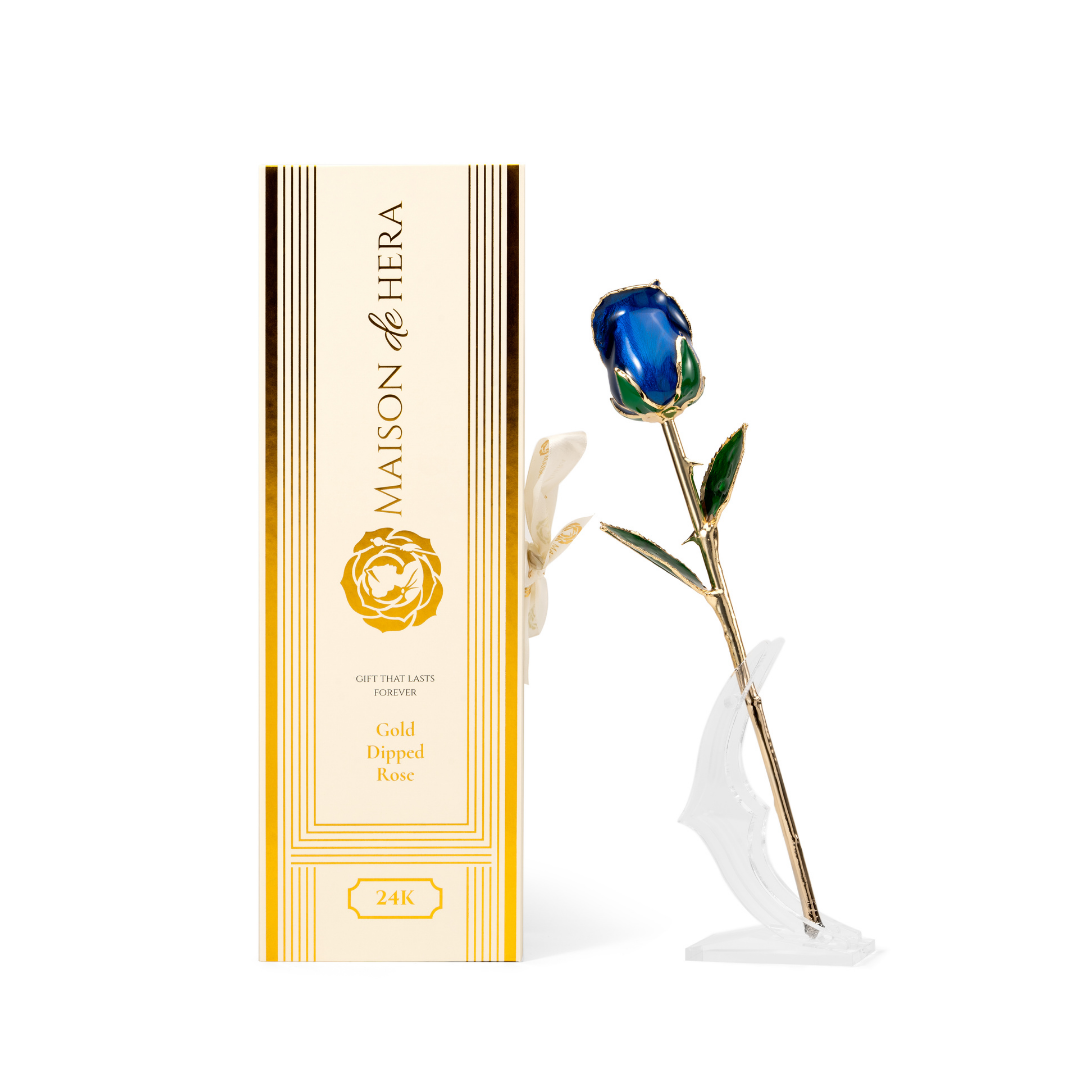 Maison de Hera Blanc box next to 24K gold dipped blue rose with green enamel leaves, Elegante edition