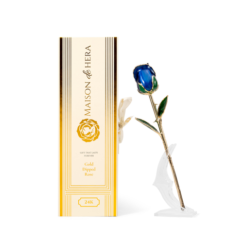 Maison de Hera Blanc box next to 24K gold dipped blue rose with green enamel leaves, Elegante edition