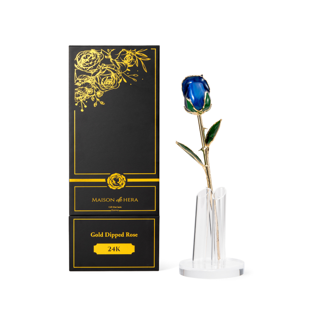 Maison de Hera Maison box next to 24K gold dipped blue rose with green enamel leaves, Elegante edition