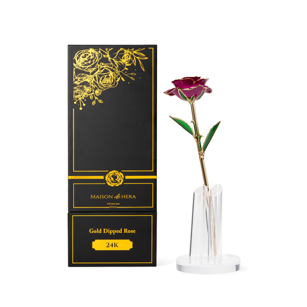 Maison de Hera Maison box next to 24K gold dipped purple rose with green enamel leaves