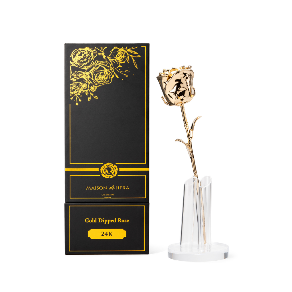 Maison de Hera black Maison Edition box next to 24K gold dipped rose on clear display stand